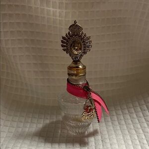 Empty Juicy Couture perfume bottle